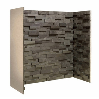 Black split face slate fireplace chamber lining set on white wall