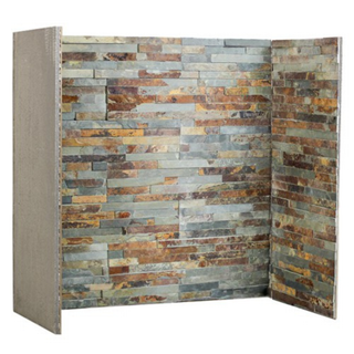 Multi-colour slate fireplace chamber lining set on white wall