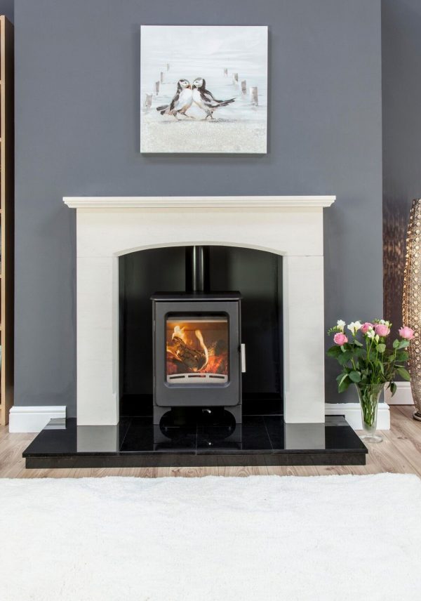 Ashcott stove surrounded by white fireplace